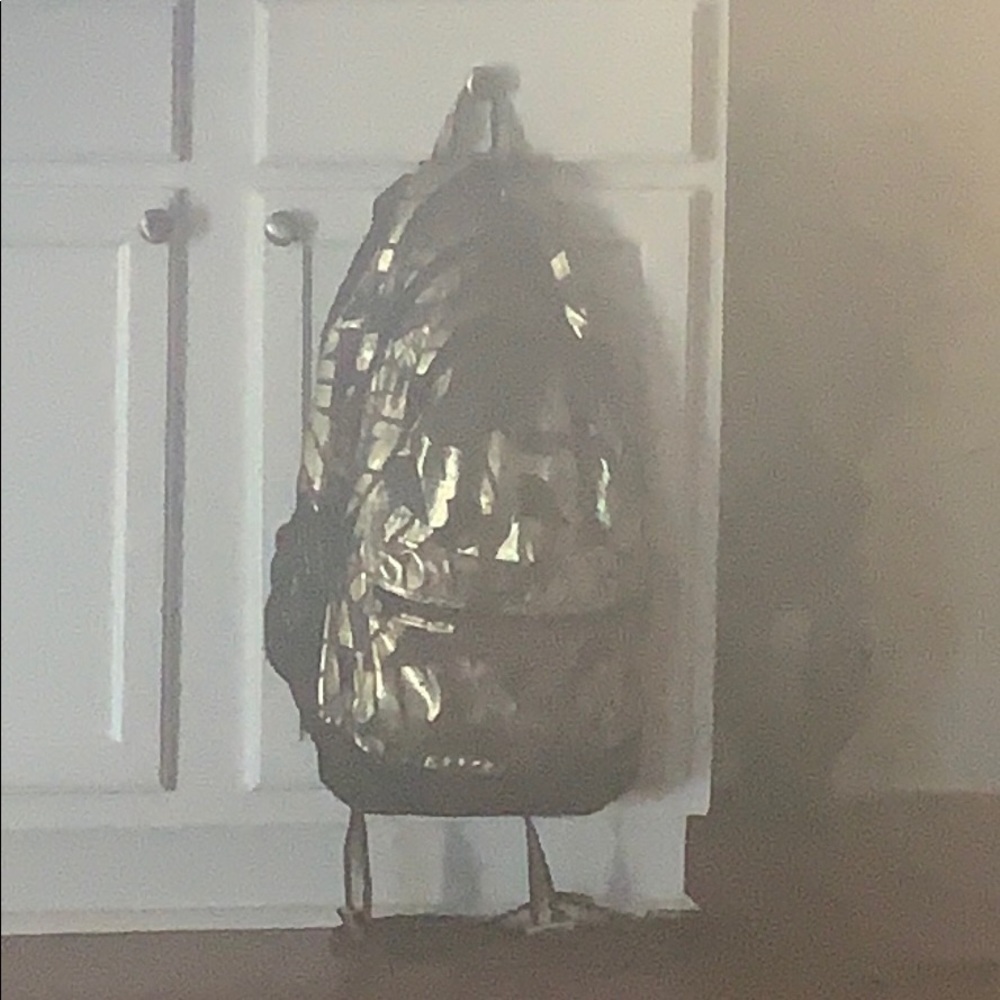 A gold and black backpack